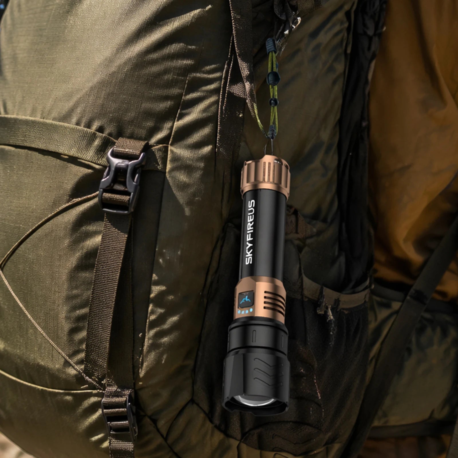SkyFire 1097 aluminum flashlight held beside outdoor gear